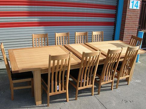 2.4 - 2.9m Tallinn butterfly extending table with Winchester leather chairs.  Table 699, chairs 85 each 